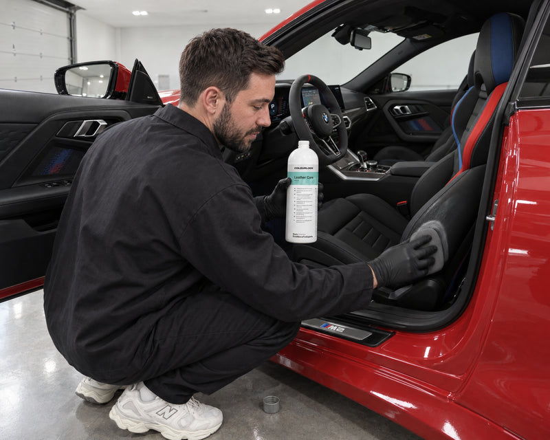 Detailing1 hero: leather care — COLOURLOCK Leather Care conditions pigmented smooth leather on a BMW M2 seat (desktop)