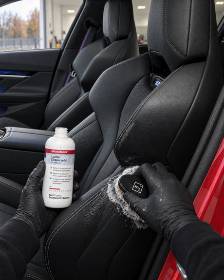 Detailing1 cleaning leather — foam on the Koch-Chemie Leather Brush at the seat bolster, COLOURLOCK Leather Cleaner (Mild)