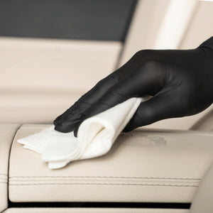 Detailing1 COLOURLOCK New Leather Care Set — wiping down a light leather armrest with a viscose cloth