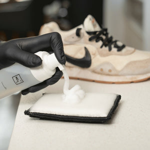 Detailing1 COLOURLOCK Sneaker Cleaner Set — cleaning foam on the pad, the dirty sneaker behind it